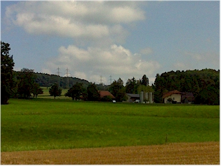 Landschaft mit Bauernhof